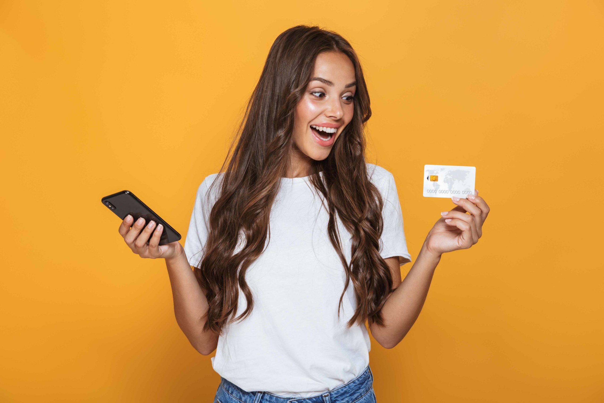 Debit Card - Latina X woman smiling with a debit card